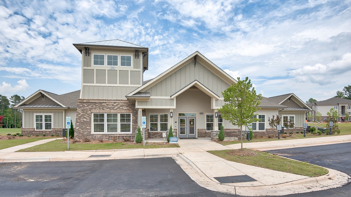 a large house with a street in front of it