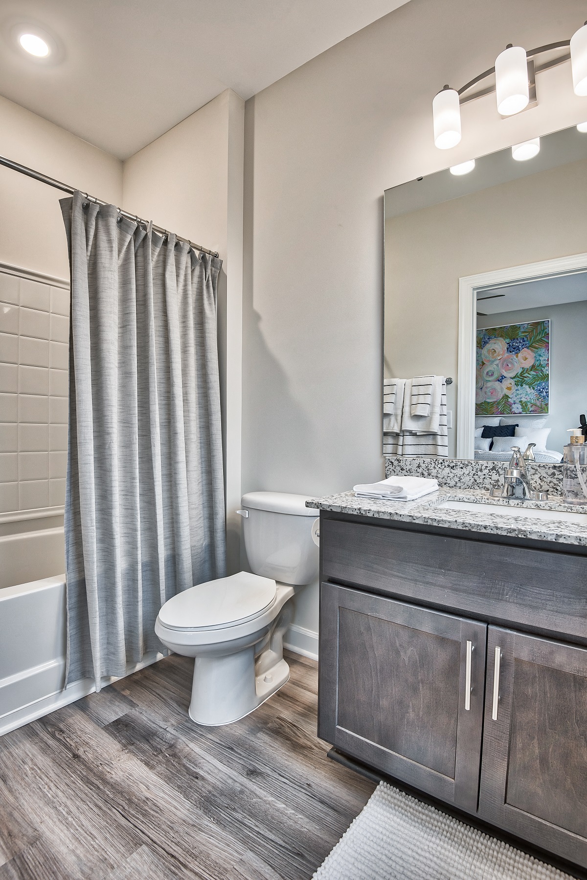 an open bathroom with a shower and a toilet