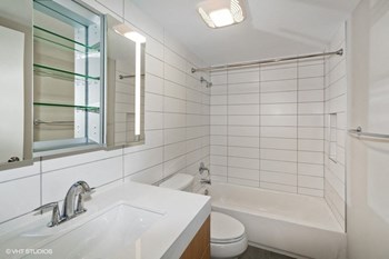 a bathroom with a sink toilet and bathtub - Photo Gallery 14