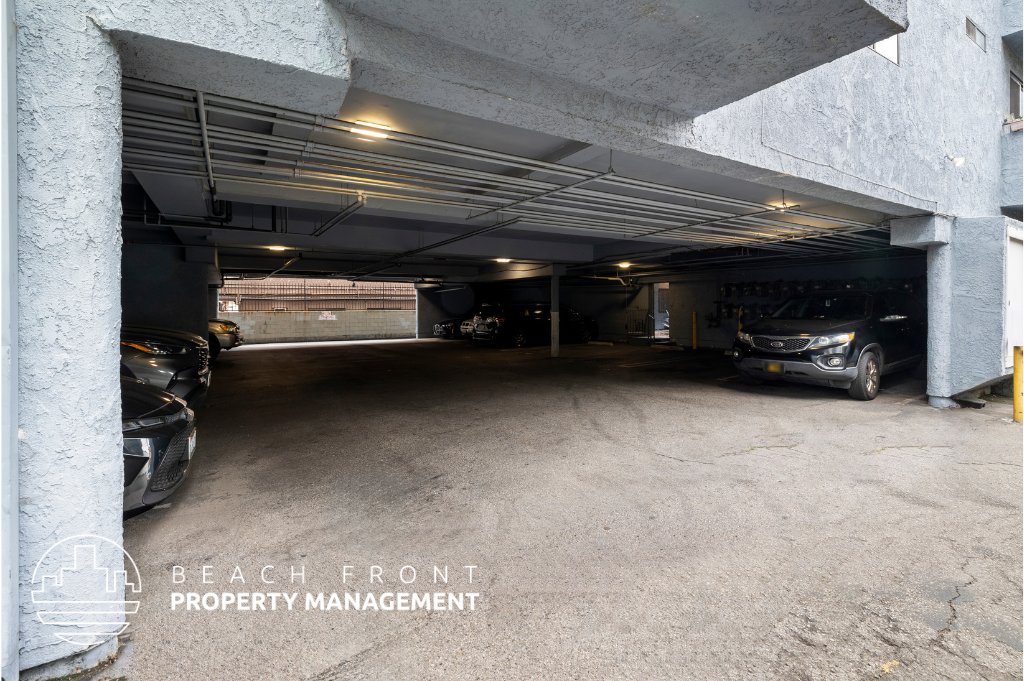 an empty parking garage with cars in it