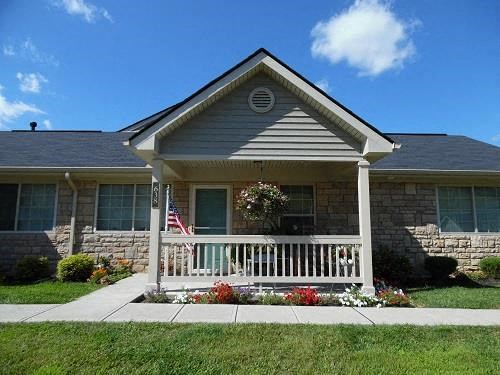 a house with a porch and an flag
