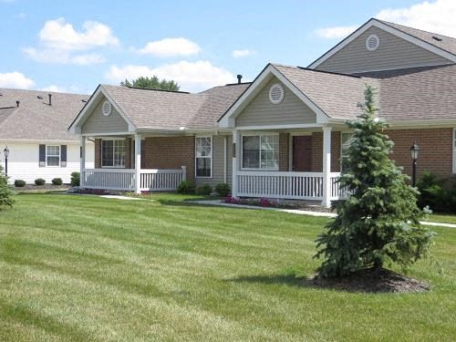 a house with a tree in the front of it