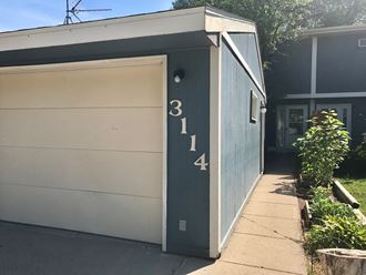 the side of a building with a garage door