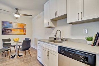 Apartments in Fremont CA - Metro Fremont - Grey Countertops, Stainless-Steel Appliances, White Cabinets, and Wood-Style Floors - Photo Gallery 6