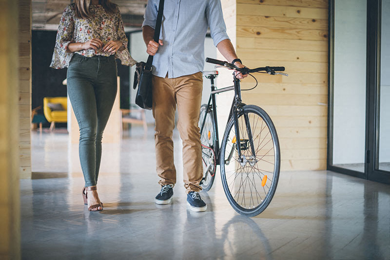 Metro Fremont | Apartments |  couple walking with bike