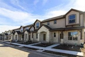 a row of houses on the side of a street