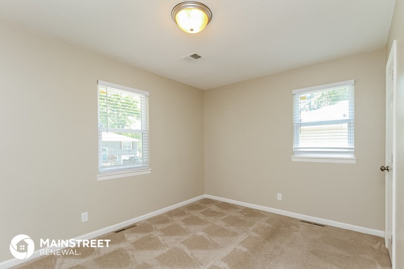 the bedroom of this home has been remodeled and is empty