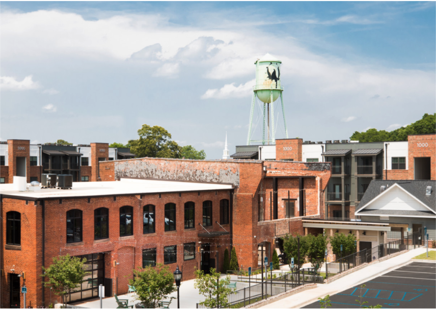 a view of a building with a water tower in the background