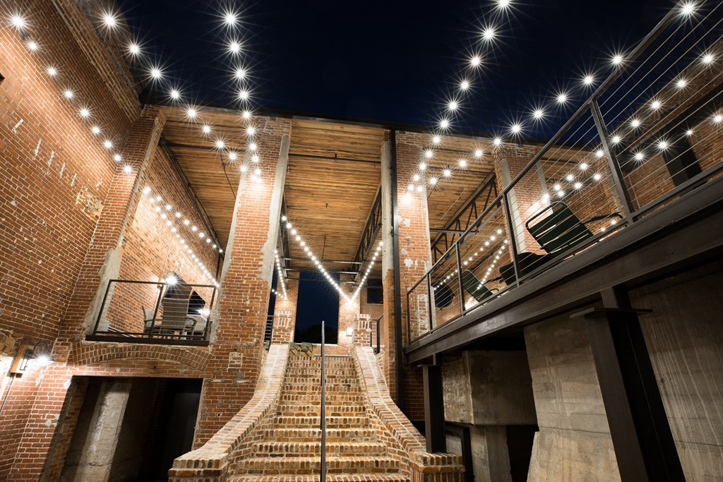 the stairs of the building are lit up at night