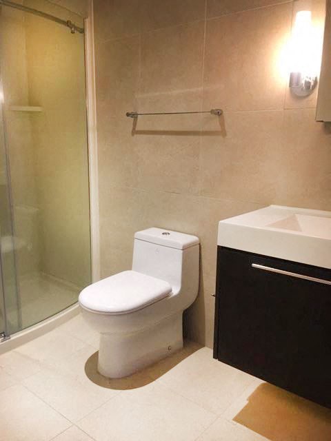 a bathroom with a toilet and a sink