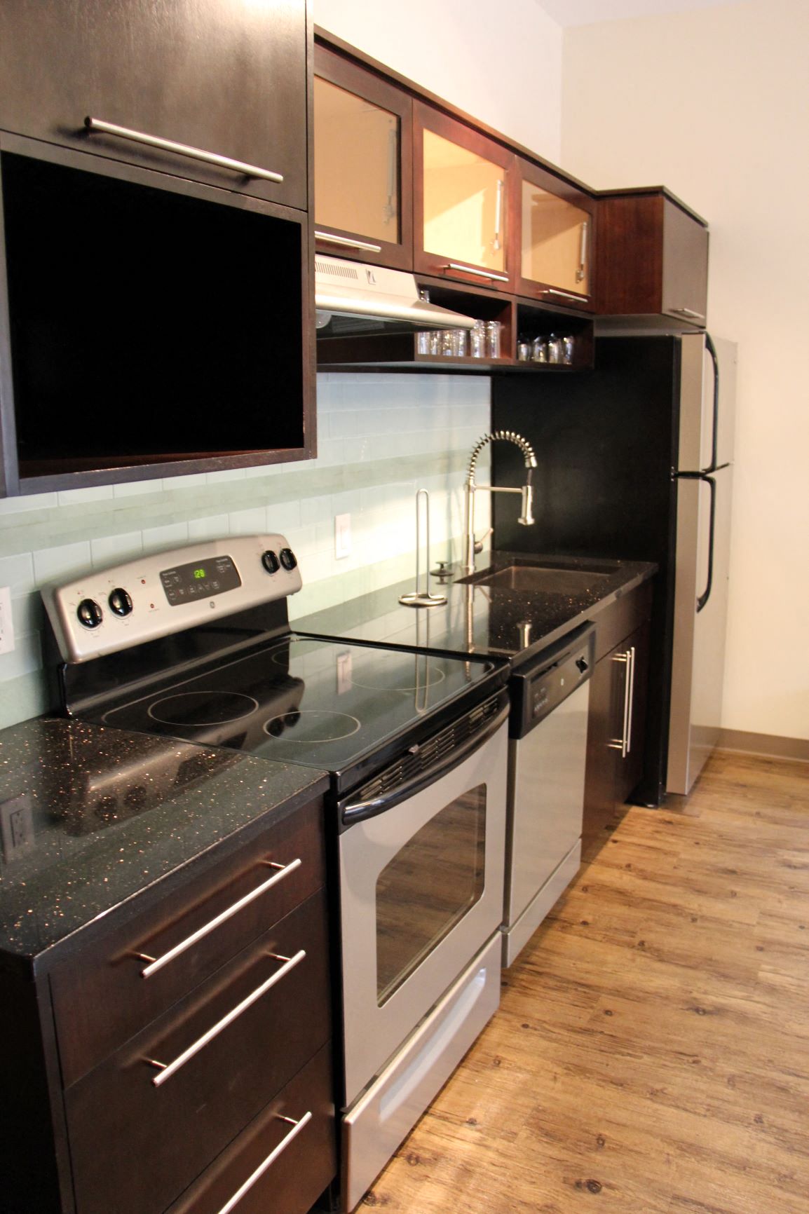 a kitchen with a stove and a sink