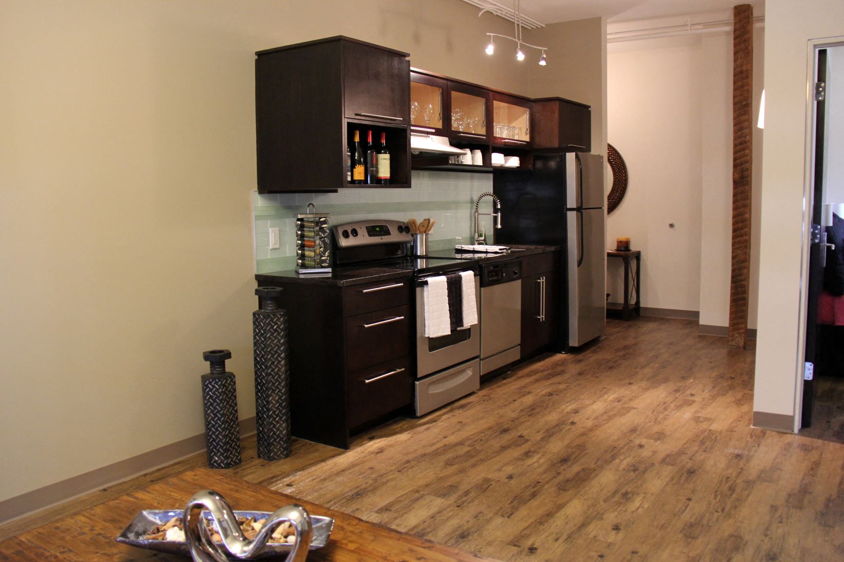 a small kitchen with a stove and a refrigerator