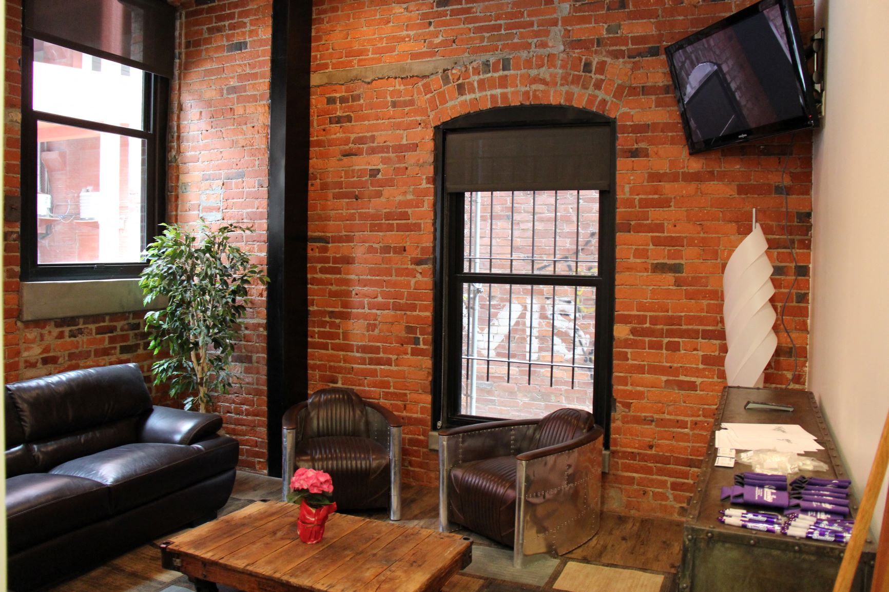 a living room with a couch and a table and a television