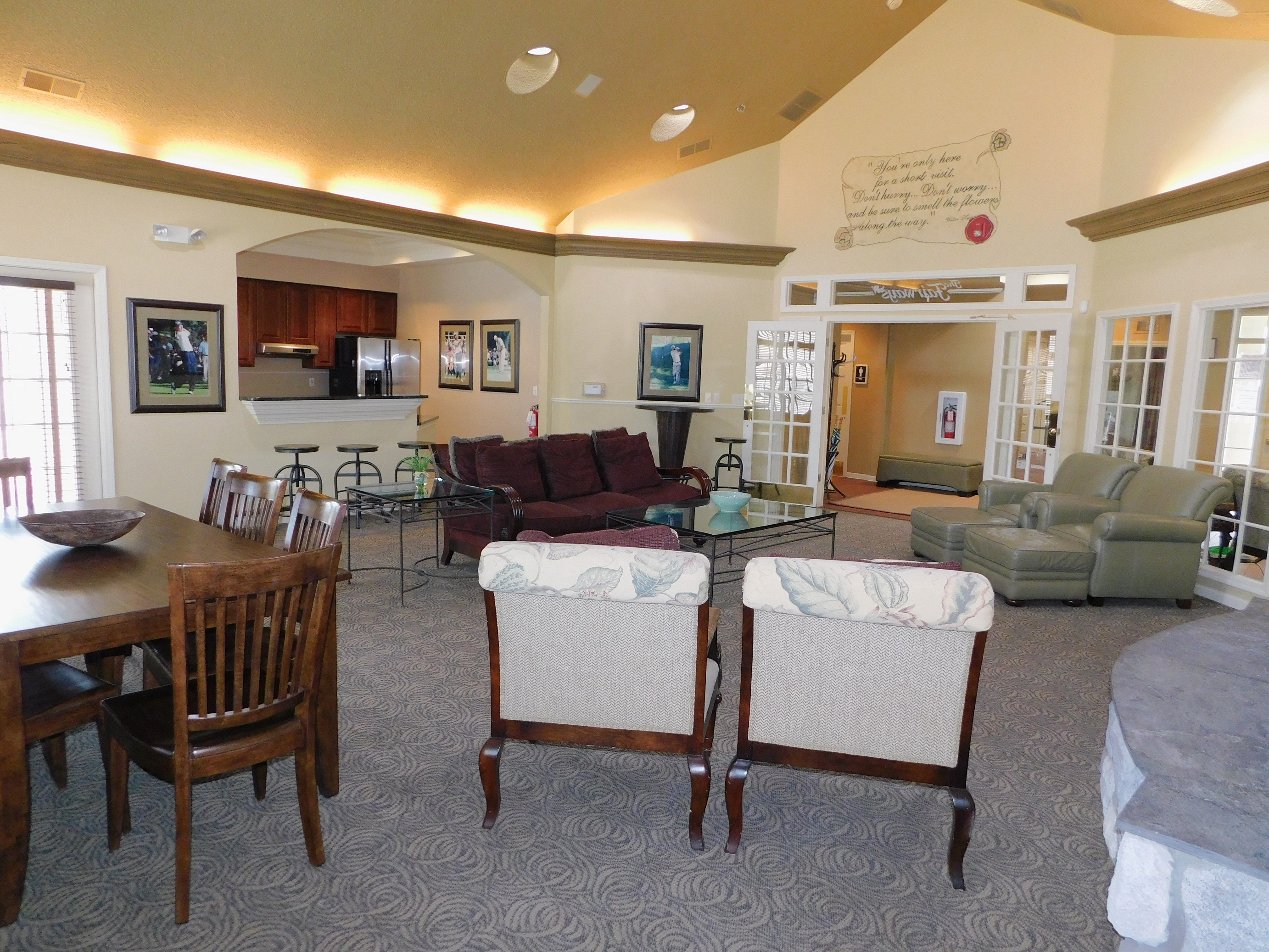 a view of a living room with furniture and a table