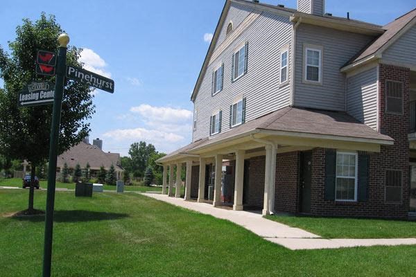 a house with a street sign in front of it