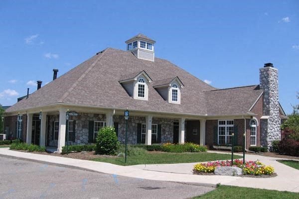 a large house with a chimney on the roof