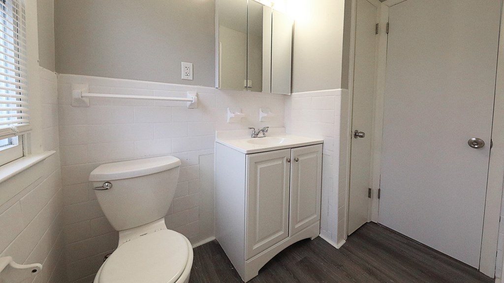 an empty bathroom with a toilet and a sink