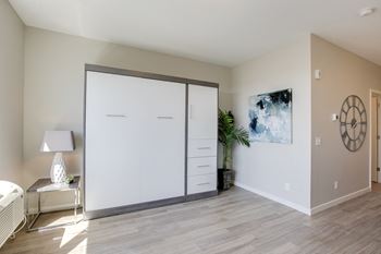 Room with closed murphy bed against the wall