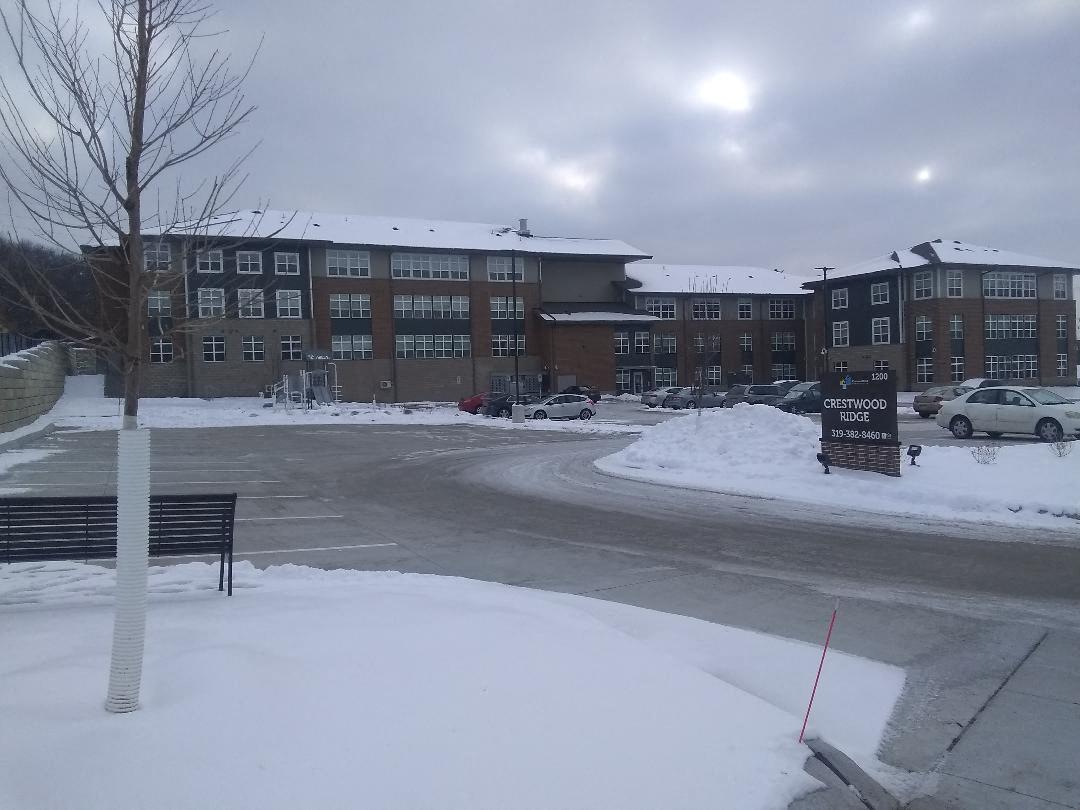 a building on the side of a street in the snow