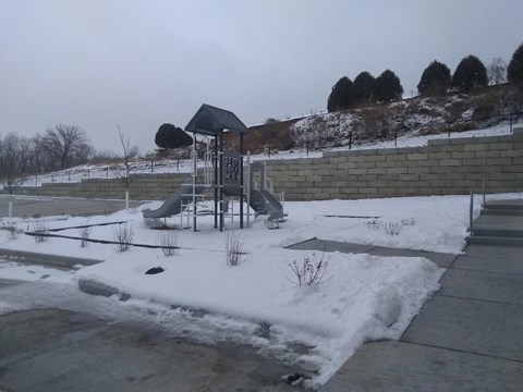 a playground is covered in snow