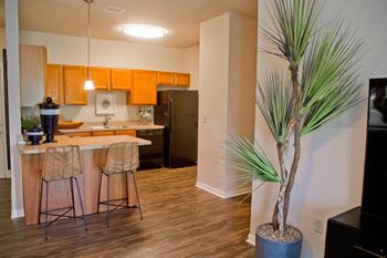 Luxury Vinyl Plank Flooring In Kitchen And Living Room at The Manor Homes of Eagle Glen, Missouri