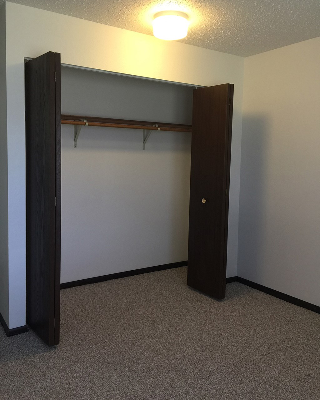 a room with a closet and an open door