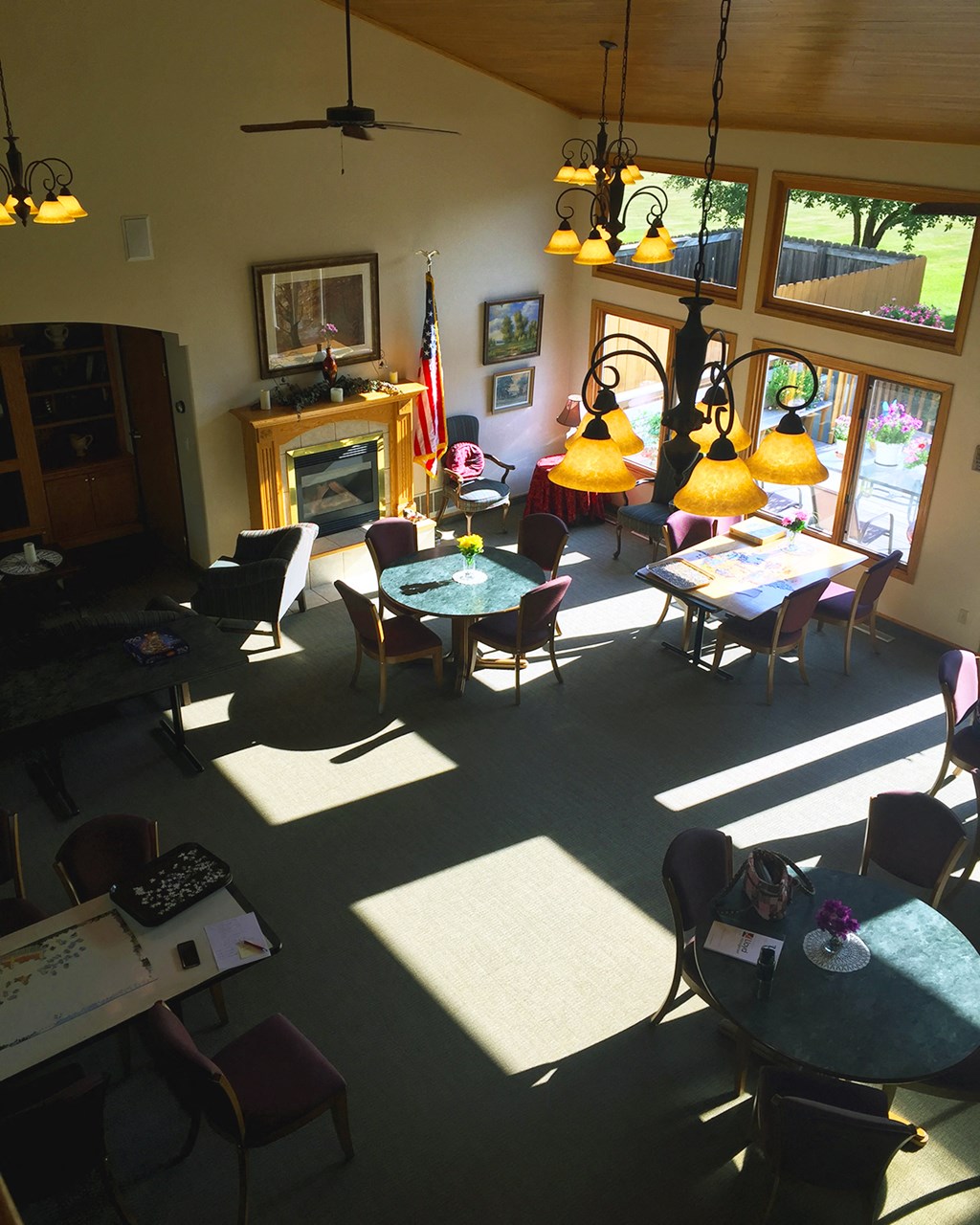 a dining room with tables and chairs and a fireplace
