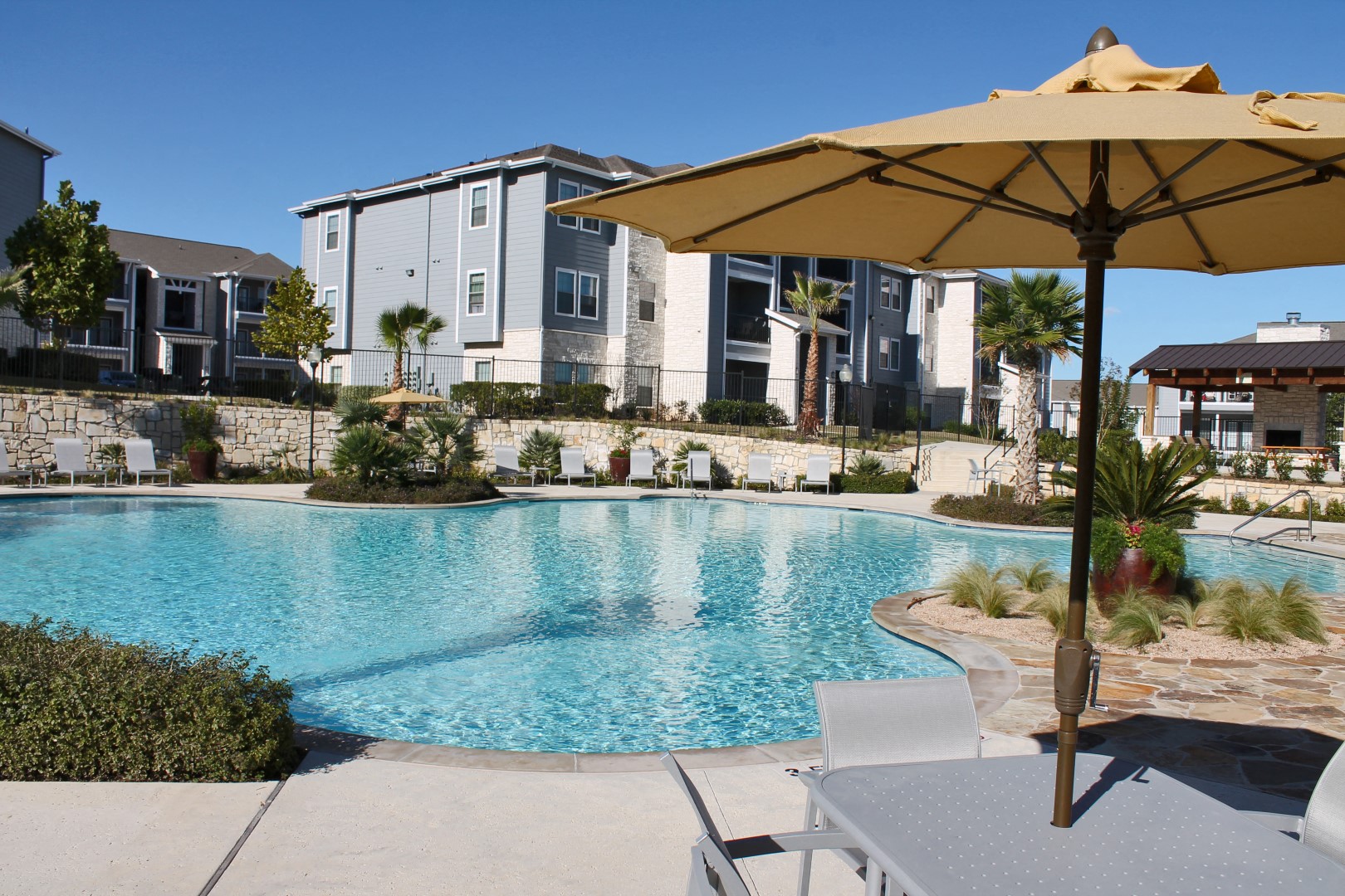 poolside underneath the umbrella