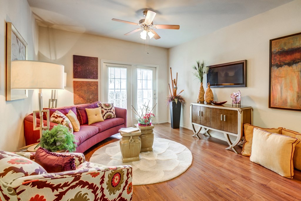 living room area with red sofas