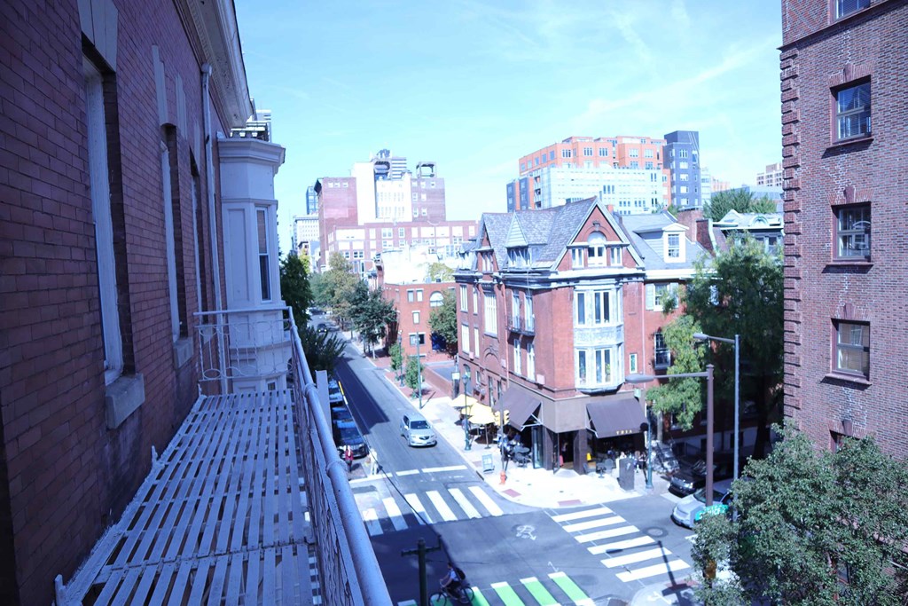 a view of a city street from a balcony