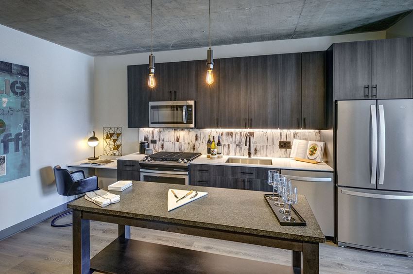 contemporary kitchen with an island at The Mason apartments - Photo Gallery 1