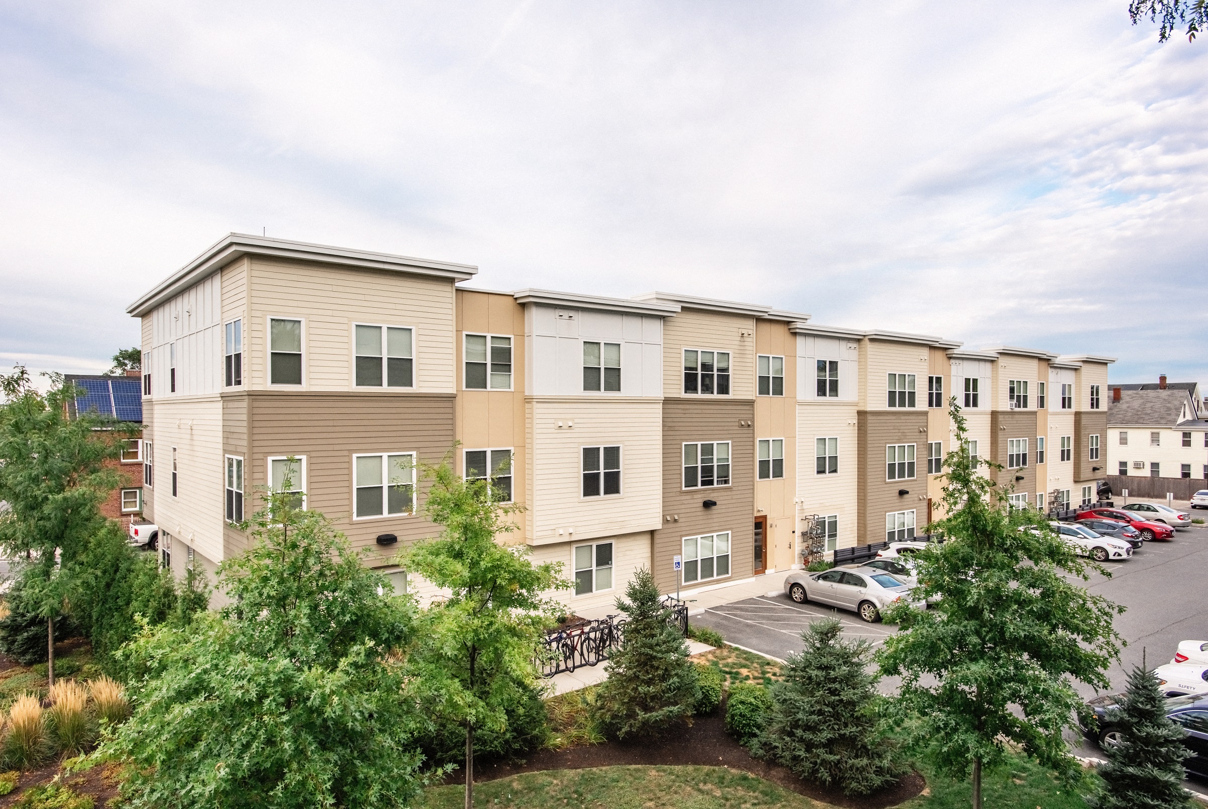 Back of Building with Landscaping and Parking Lot