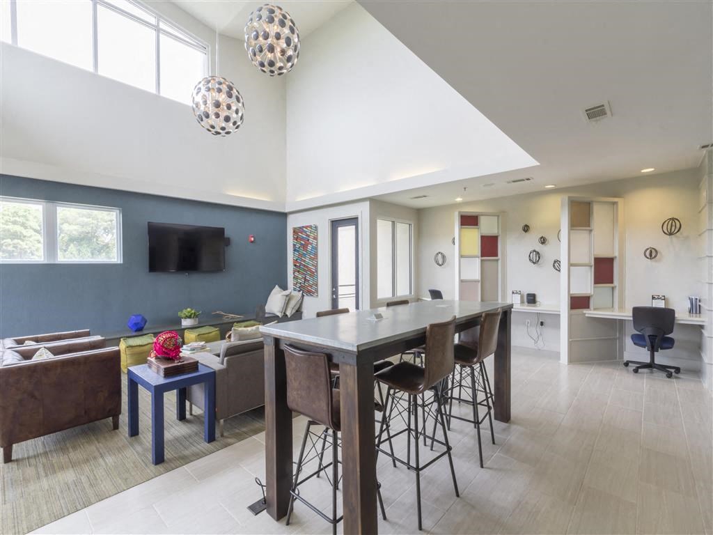 a dining room and living room with a table and chairs