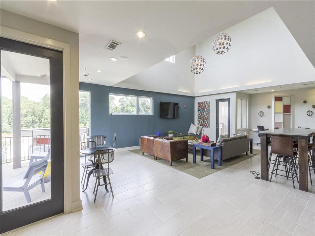 a living room with a couch and a table and a television