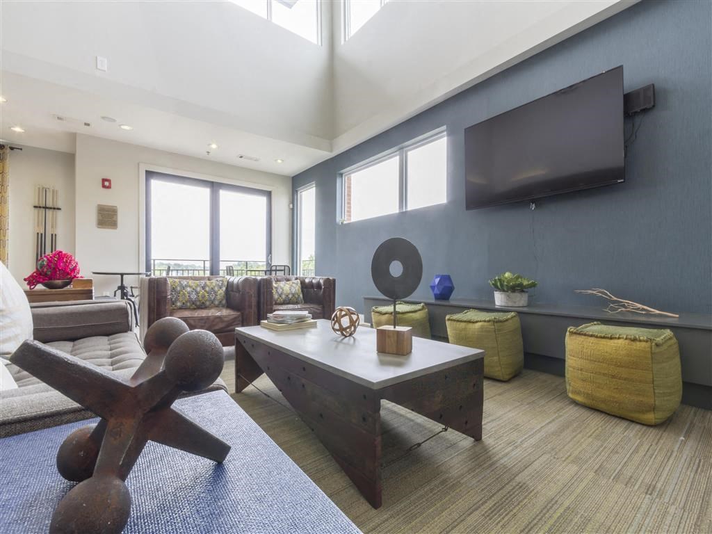 a living room with a couch and a table and a television