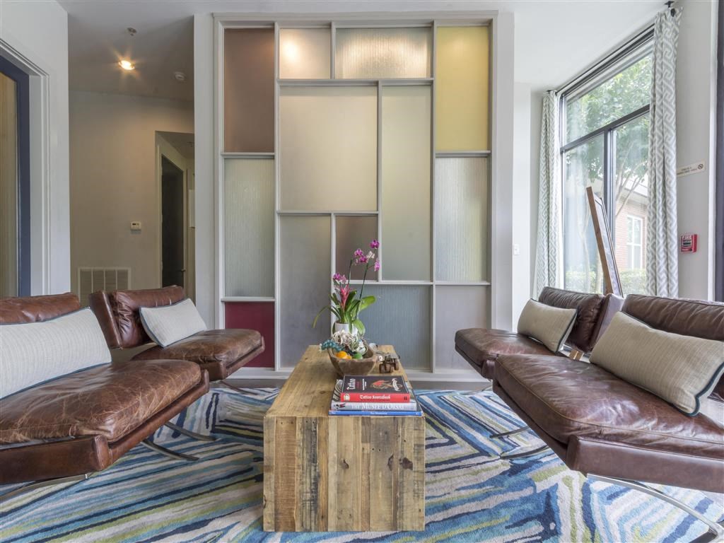 a living room with couches and a coffee table