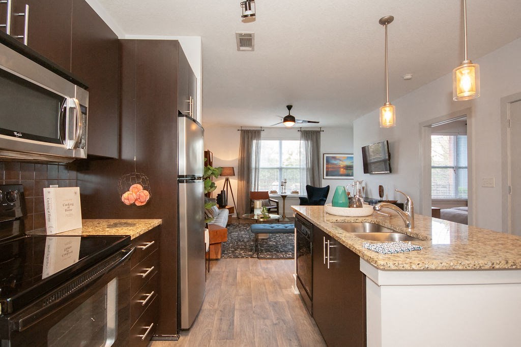 a kitchen with a sink and a counter top