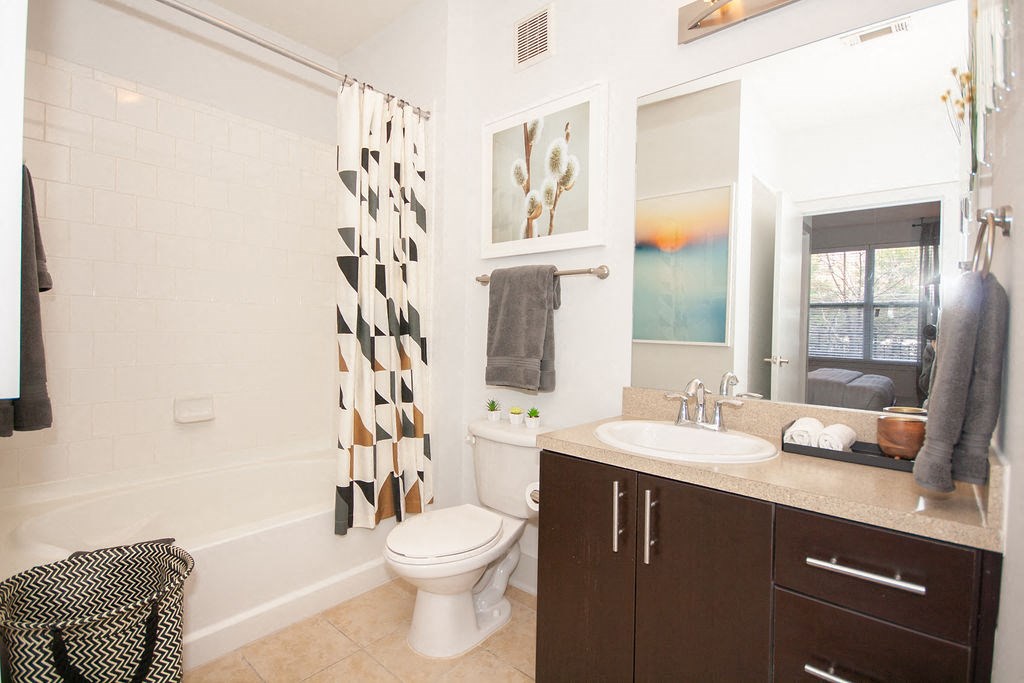 a bathroom with a sink toilet and a shower