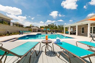 our apartments have a large pool and a patio with tables