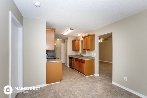 a kitchen with wooden cabinets and a counter top