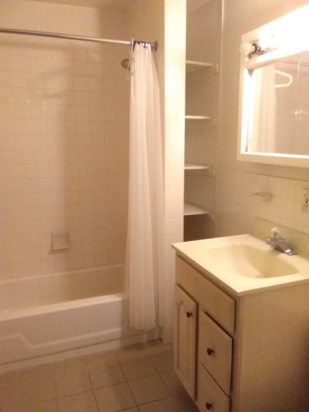 a bathroom with a sink and a shower