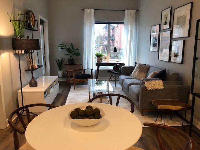 a living room with a table and a couch