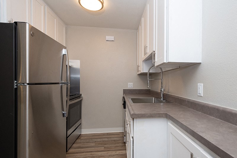 Apartments for Rent in Portland, OR - Ellinwood Kitchen with Stainless Steel Appliances, and Modern White Wood Cabinets