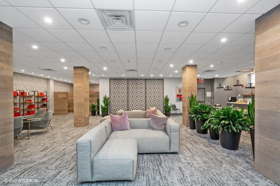 a large room with a large couch in the middle of it