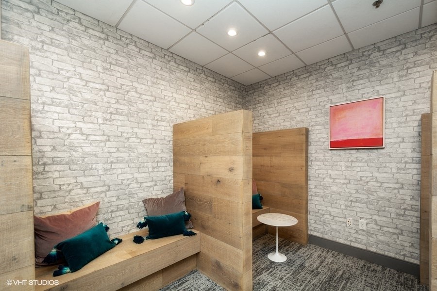 a room with a bunk bed and a small table