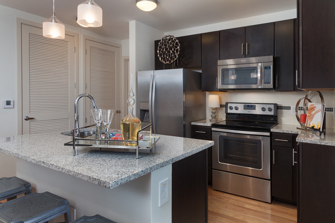All kitchens feature stainless steel appliances and some include a breakfast bar.