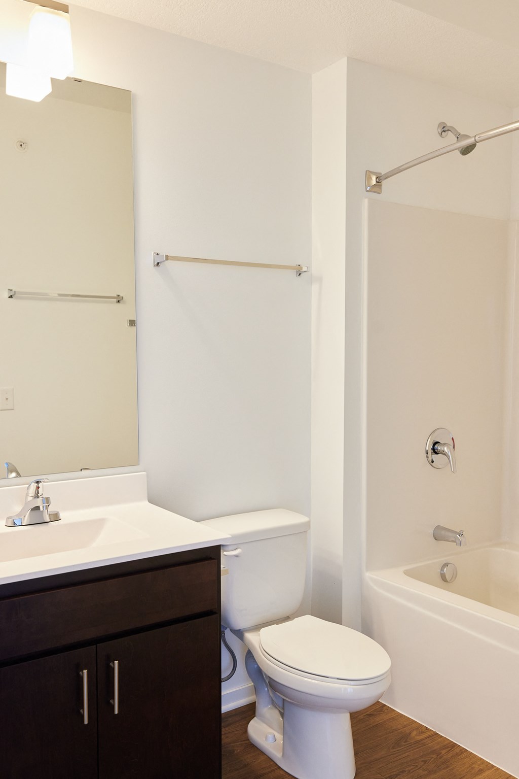 a bathroom with a toilet and a sink and a bath tub