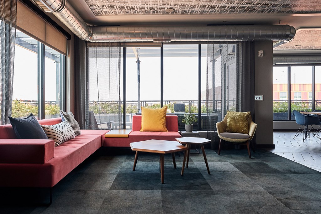 a living room with couches and chairs and a table