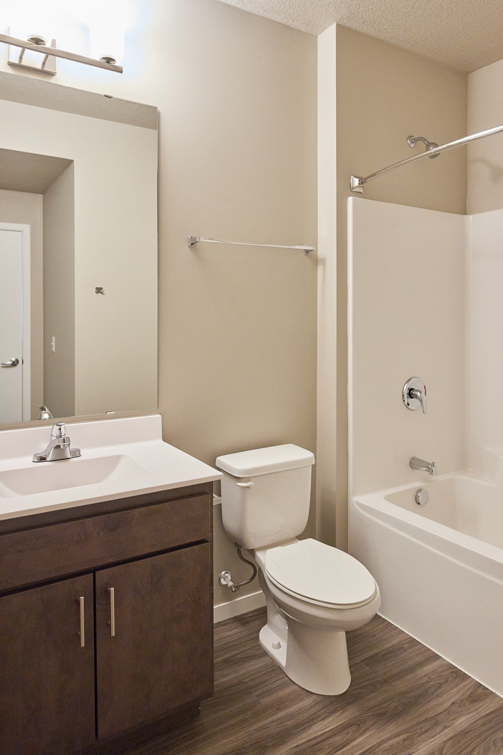 an empty bathroom with a toilet sink and shower