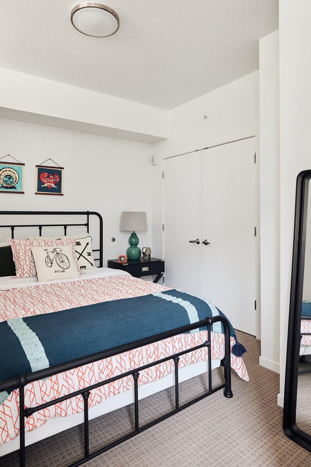 a bedroom with a bed and a closet